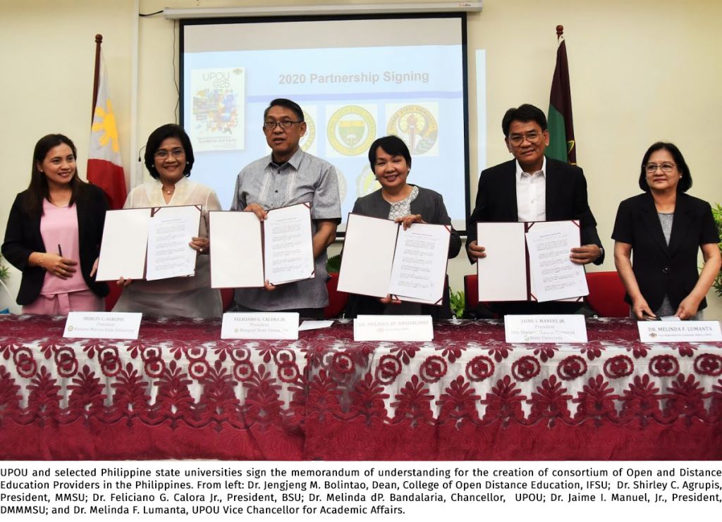 UPOU and selected Philippine state universities sign the memorandum of understanding for the creation of consortium of Open and Distance Education Providers in the Philippines. From left: Dr. Jengjeng M. Bolintao, Dean, College of Open Distance Education, IFSU; Dr. Shirley C. Agrupis, President, MMSU; Dr. Feliciano G. Calora Jr., President, BSU; Dr. Melinda dP. Bandalaria, Chancellor, UPOU; Dr. Jaime I. Manuel, Jr., President, DMMMSU; and Dr. Melinda F. Lumanta, UPOU Vice Chancellor for Academic Affairs.