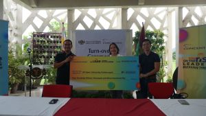 Photo shows Chancellor Melinda Bandalaria (center) receiving the donation from Mr. Alvin Laxa (left) and Mr. Alnard Pagulayan (right).