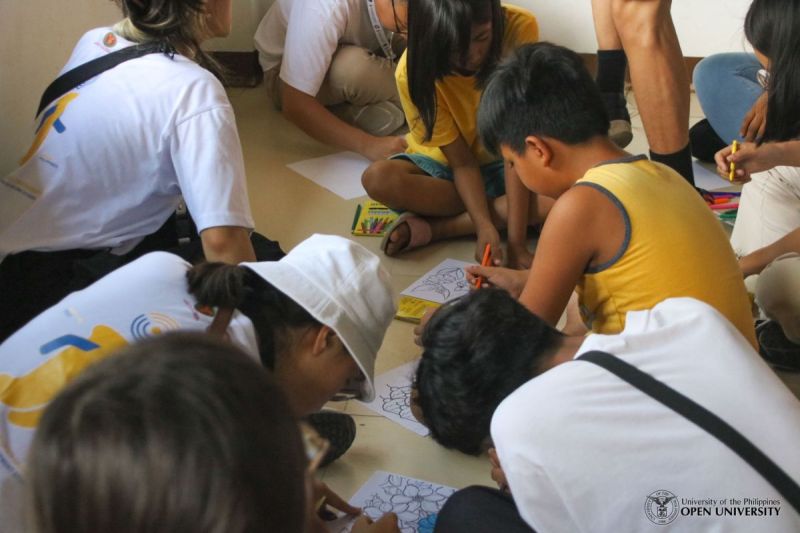 9 July 2023 – Project LAKBAY fellows facilitating a drawing and coloring activity for the children of Gawad Kalinga LB Ville.